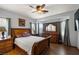 Bedroom with wood floors, a ceiling fan, and classic furniture at 4410 S Gressa St, Pahrump, NV 89061