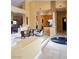 Bright foyer with tile flooring offers a view of the formal living room and dining area at 4554 Blue Mesa Way, Las Vegas, NV 89129