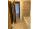 Functional bathroom with tile flooring, bathtub, and open doorway, offering convenient access at 4564 Dennis Way, Las Vegas, NV 89121