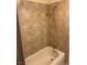 Clean bathtub with tiled wall and showerhead at 4564 Dennis Way, Las Vegas, NV 89121