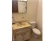 Bathroom featuring a sink with vanity, mirror, and standard toilet at 4564 Dennis Way, Las Vegas, NV 89121