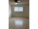 Bedroom with tile floor, ceiling fan and window at 4564 Dennis Way, Las Vegas, NV 89121
