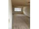 A living room with a large window, beige carpet and white walls at 4564 Dennis Way, Las Vegas, NV 89121