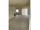 Living room with sliding glass door and carpet at 4564 Dennis Way, Las Vegas, NV 89121