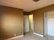 Neutral bedroom with walk-in closet, tile floors, and natural light at 4778 Beadle St, Las Vegas, NV 89122