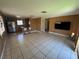 Spacious open floor plan with tile flooring, breakfast bar, and natural light at 4778 Beadle St, Las Vegas, NV 89122