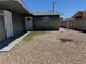 Side yard featuring low-maintenance desert rock and access gate at 4778 Beadle St, Las Vegas, NV 89122