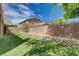 Artificial grass and mature shade trees in this well-maintained backyard at 484 Merseyside Dr, Las Vegas, NV 89178