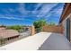 This outdoor deck offers views of the neighborhood, trees, and blue skies at 484 Merseyside Dr, Las Vegas, NV 89178