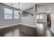 Dining room with hardwood floors, elegant chandelier, and lots of natural light at 484 Merseyside Dr, Las Vegas, NV 89178