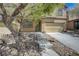 Inviting two-story home featuring neutral stucco, a two car garage, and a manicured front yard at 484 Merseyside Dr, Las Vegas, NV 89178