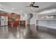 Open concept kitchen with wood cabinets, stainless steel appliances, and wood flooring at 484 Merseyside Dr, Las Vegas, NV 89178