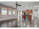 Bright open-concept living space with modern kitchen and view to the outdoor patio at 484 Merseyside Dr, Las Vegas, NV 89178