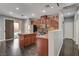 Modern kitchen with stainless steel appliances, central island, and sliding door to patio at 484 Merseyside Dr, Las Vegas, NV 89178