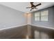 Bright, open living room with new hardwood floors, lots of light and a ceiling fan at 484 Merseyside Dr, Las Vegas, NV 89178