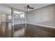 Inviting living room with hardwood floors and view into the open concept kitchen at 484 Merseyside Dr, Las Vegas, NV 89178