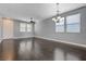 Combined living and dining room with hardwood floors, and abundant natural light at 484 Merseyside Dr, Las Vegas, NV 89178