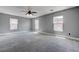 Open loft space with neutral carpet, great natural light, and ceiling fan with decorative lighting at 484 Merseyside Dr, Las Vegas, NV 89178