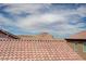 This roof features orange tile and a view of a hill and sky at 484 Merseyside Dr, Las Vegas, NV 89178