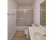 A standard bathroom that includes a vanity sink, toilet, and enclosed tub and shower at 4955 Jeffreys St # 403, Las Vegas, NV 89119