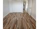 A cozy bedroom featuring stylish laminate flooring and a closet at 4955 Jeffreys St # 403, Las Vegas, NV 89119