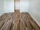 A clean bedroom with wood-style laminate flooring and a closet at 4955 Jeffreys St # 403, Las Vegas, NV 89119