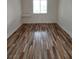 A bright bedroom with new flooring and a window providing natural light at 4955 Jeffreys St # 403, Las Vegas, NV 89119