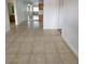 An open concept living room features tile floors, and easy access to the kitchen and bathroom areas at 4955 Jeffreys St # 403, Las Vegas, NV 89119