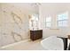 Bright bathroom features a soaking tub and modern double vanity sink at 5009 Elm Grove Dr, Las Vegas, NV 89130