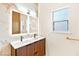 Bathroom with modern double vanity, stylish mirrors, and brass accents at 5009 Elm Grove Dr, Las Vegas, NV 89130