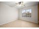 Empty bedroom with wood-look tile, a ceiling fan, and a bright window at 5009 Elm Grove Dr, Las Vegas, NV 89130