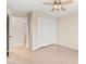 Bedroom with wood-look tile, ceiling fan, and closet with sliding doors at 5009 Elm Grove Dr, Las Vegas, NV 89130