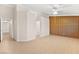 Spacious bedroom with ample natural light, neutral walls, and wood-look tile flooring at 5009 Elm Grove Dr, Las Vegas, NV 89130