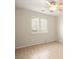 Bedroom featuring wood-look tile, neutral paint, and a bright window view at 5009 Elm Grove Dr, Las Vegas, NV 89130