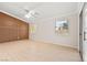 Bedroom featuring stylish wood accent wall and sliding glass door access at 5009 Elm Grove Dr, Las Vegas, NV 89130