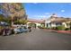 Exterior shot of the clubhouse entrance with golf carts parked outside at 5009 Elm Grove Dr, Las Vegas, NV 89130