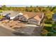 Attractive home displays a red tile roof, attached garage, and landscaped front yard at 5009 Elm Grove Dr, Las Vegas, NV 89130