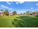 Expansive view of a well-manicured golf course with green grass and mature trees at 5009 Elm Grove Dr, Las Vegas, NV 89130