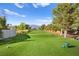 Picturesque view of the golf course featuring mountain views and mature trees at 5009 Elm Grove Dr, Las Vegas, NV 89130