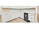 Kitchenette featuring white cabinets, quartz countertops, wine refrigerator, and mosaic backsplash at 5009 Elm Grove Dr, Las Vegas, NV 89130
