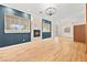 Bright living room featuring a modern fireplace, updated lighting fixtures, and a spacious open floor plan at 5009 Elm Grove Dr, Las Vegas, NV 89130