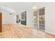 Spacious living room with wood floors, fireplace, modern light fixture, and backyard access at 5009 Elm Grove Dr, Las Vegas, NV 89130