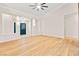 Bright living room features light wood flooring and a modern ceiling fan at 5009 Elm Grove Dr, Las Vegas, NV 89130