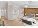 Stylish primary bedroom featuring a wood accent wall, a plush bed, and modern decor for a serene retreat at 5009 Elm Grove Dr, Las Vegas, NV 89130