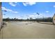 View of the community's well-maintained tennis courts with lighting and seating at 5009 Elm Grove Dr, Las Vegas, NV 89130