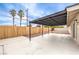 Large, covered patio with a fenced yard featuring desert landscaping at 516 Donner St, Las Vegas, NV 89107