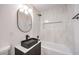 Stylish bathroom with modern vanity, black fixtures, and tiled shower for a contemporary look at 516 Donner St, Las Vegas, NV 89107