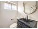 Half-bathroom features a modern vanity, sleek faucet, and updated fixtures at 516 Donner St, Las Vegas, NV 89107