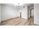 Bright bedroom with contemporary chandelier, tiled floors and ensuite bathroom at 516 Donner St, Las Vegas, NV 89107