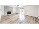 Bright living room with tile fireplace and sliding glass doors leading to backyard at 516 Donner St, Las Vegas, NV 89107